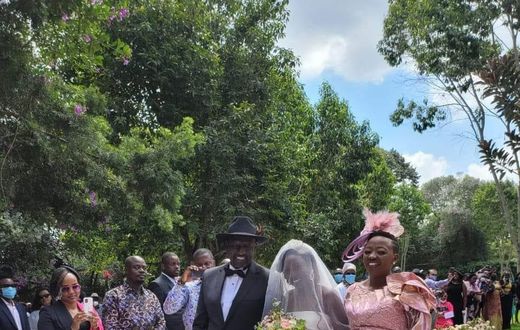 Deputy President William Ruto and wife Rachel walk June Ruto on the aisle at her wedding
