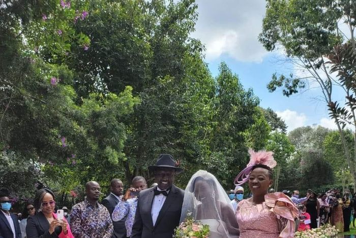 Deputy President William Ruto and wife Rachel walk June Ruto on the aisle at her wedding