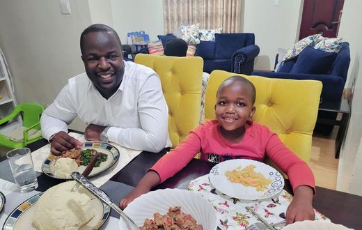 Kevin Otiende and Ethan Macharia enjoying dinner