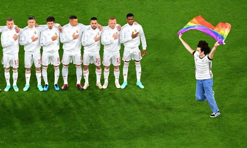 One fan invaded the pitch to brandish a rainbow flag
