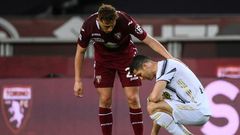 Torino defender Mergim Vojvoda (C) comforts Juventus' Cristiano Ronaldo after a 2-2 stalemate.