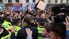 Chelsea's Petr Cech (3L) attempts to talk to supporters
