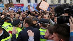 Chelsea's Petr Cech (3L) attempts to talk to supporters