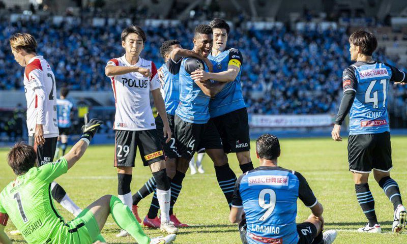 Kawasaki Frontale's Jesiel (C) celebrates after scoring a goal during the J-League football match between Kawasaki Frontale and Urawa Reds in Kawasaki