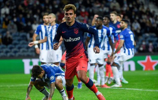 Antoine Griezmann got the opener as Atletico Madrid beat Porto to qualify for the Champions League last 16