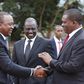 President Uhuru Kenyatta consoles National assembly speaker Justin Muturi during the burial service of the mother of National Assembly Speaker Justin Muturi in Embu County, looking on is DP WIlliam Ruto.