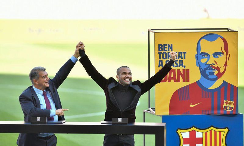 Dani Alves (right) was presented in front of Barcelona fans on Wednesday after making an incredible return to the club