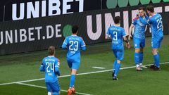 Man of the moment: Holstein Kiel defender Simon Lorenz (second right) celebrates his goal