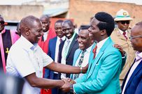 President William Ruto shaking hands with Kasmuel McOure wwhen they met during a Sunday service at A.I.C Kipkorgot church in Ainabkoi, Uasin Gishu County