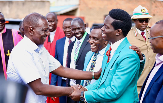President William Ruto shaking hands with Kasmuel McOure wwhen they met during a Sunday service at A.I.C Kipkorgot church in Ainabkoi, Uasin Gishu County