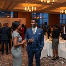 An AI-generated photo depicting business leaders connecting at a forum.