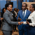 An AI-generated photo depicting business leaders connecting at a forum.