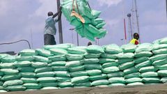 Dockworkers off-loading sugar at the port of Mombasa,