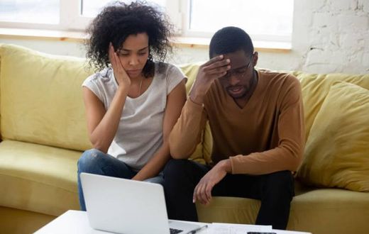 A young couple seemingly worried