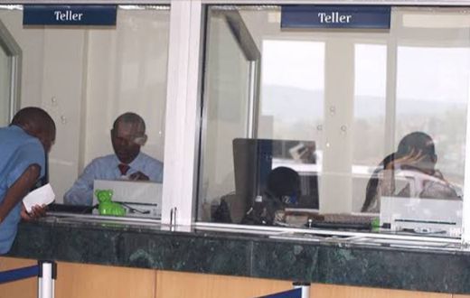 Tellers in a Kenyan bank