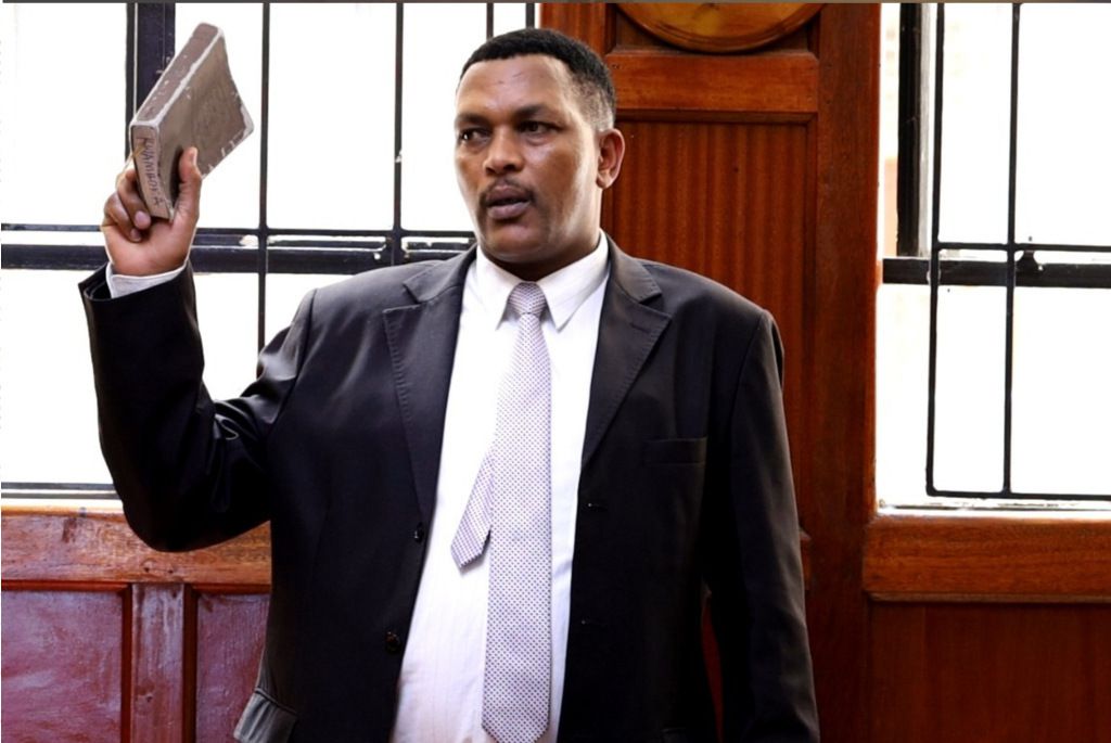 Police officer Simon Waweru taking the stand in the Rex Masai Inquest