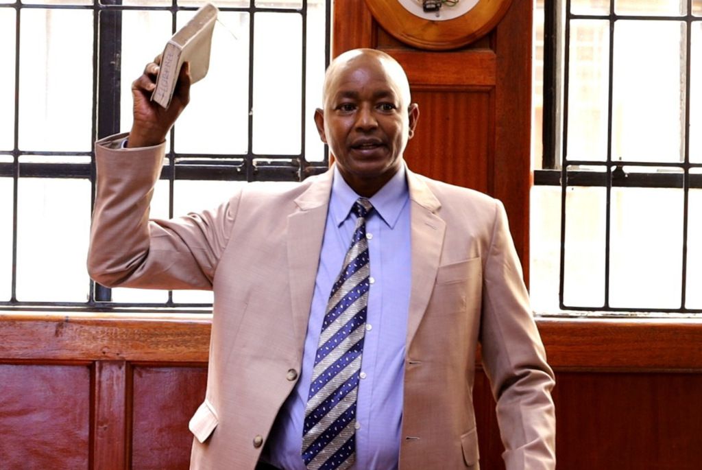 Police officer Martin Githinji taking the stand in the Rex Masai inquest