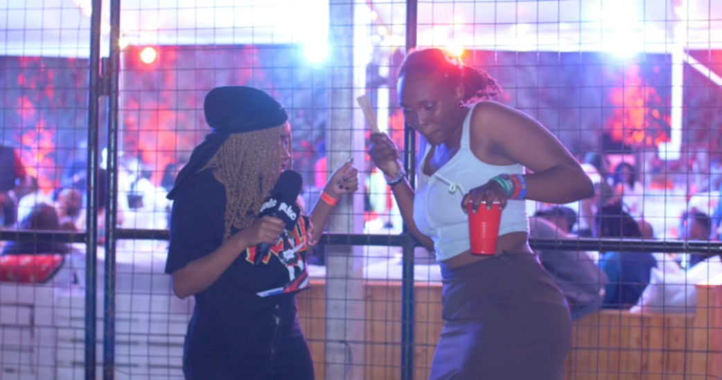 Presenter Miss Phyl and an attendee at a Kenya Cane activation in Kitengela
