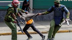 Police manhandling a protestor during protests