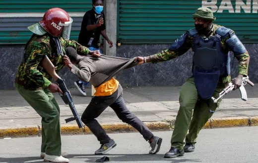 Police manhandling a protestor during protests