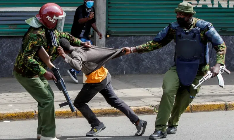 Police manhandling a protestor during protests