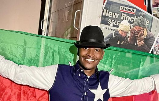 Samidoh holding the Kenyan flag