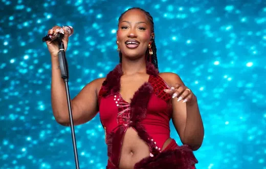 Tems performing at a past concert