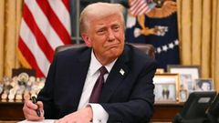 President Donald Trump signs an executive