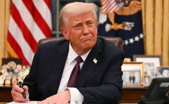 President Donald Trump signs an executive
