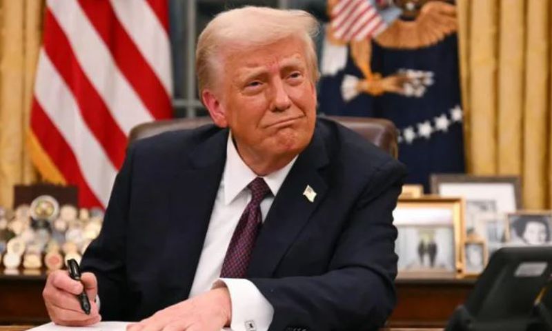 President Donald Trump signs an executive