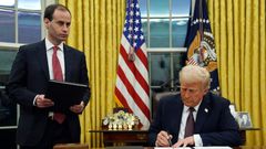 President Donald Trump signs an executive