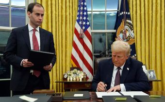 President Donald Trump signs an executive
