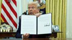 President Donald Trump signs an executive