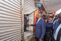 Interior CS Kipchumba Murkomen, greeting a businessman in Nairobi CBD after his shop was looted, promising increased security