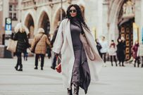 A full-length oversized wool coat