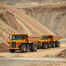 An AI-generated image of trucks at a mine for illustration purposes