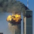 Smoke and flames erupting from the twin towers of New York City's World Trade Center after the terrorist attacks on September 11, 2001