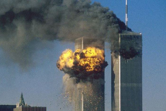 Smoke and flames erupting from the twin towers of New York City's World Trade Center after the terrorist attacks on September 11, 2001