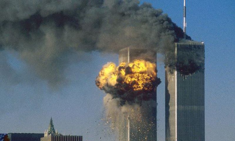 Smoke and flames erupting from the twin towers of New York City's World Trade Center after the terrorist attacks on September 11, 2001