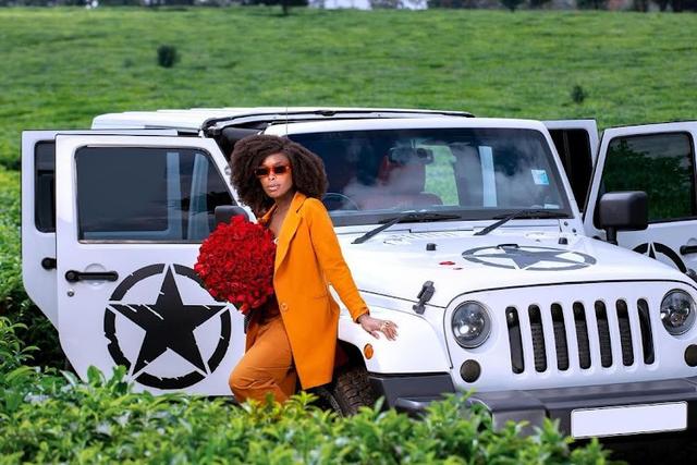 Actress Jackie Vike poses with her Jeep Wrangler