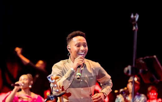 File image of Rwandan gospel musician Israel Mbonyi on stage