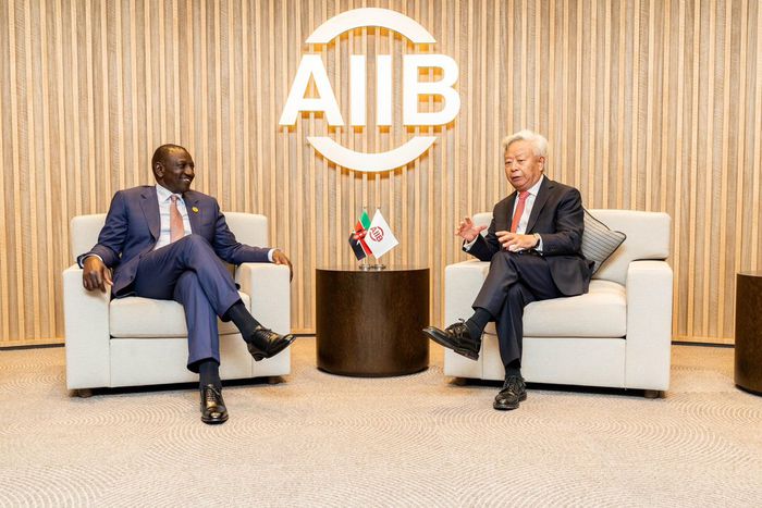 President William Ruto speaks with AIIB President and Board of Directors Chairman Jin Liqun