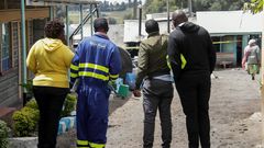 A Kenya Power employee at the scene of the Hillside Endarasha Academy fire