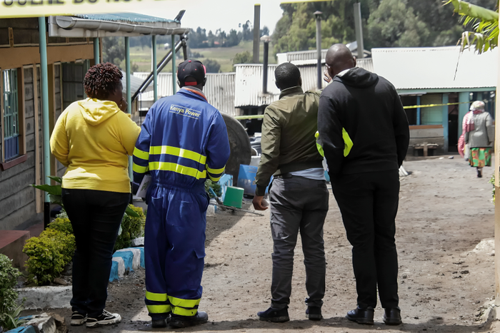 A Kenya Power employee at the scene of the Hillside Endarasha Academy fire