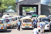 Vehicles lined up for inspection at an NTSA inspection centre