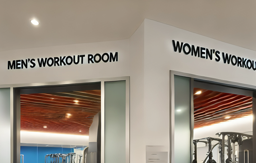 An AI-generated image of an Interior of a modern gym featuring separate workout rooms for men and women The gym is split into two distinct areas