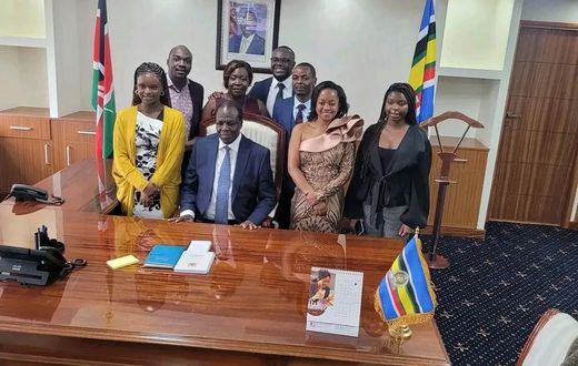 Wycliffe Oparanya with his family at his new office in the Ministry of Cabinet Secretary for Cooperatives and Micro, Small & Medium Enterprises (MSMEs) Development