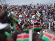 Kenyans waving flags