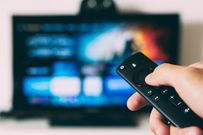 A person watching TV