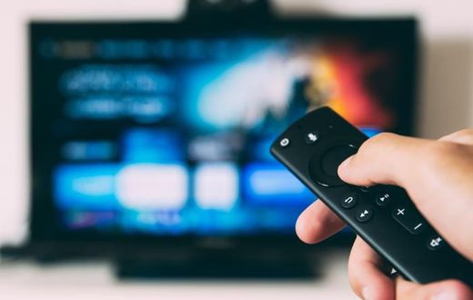 A person watching TV